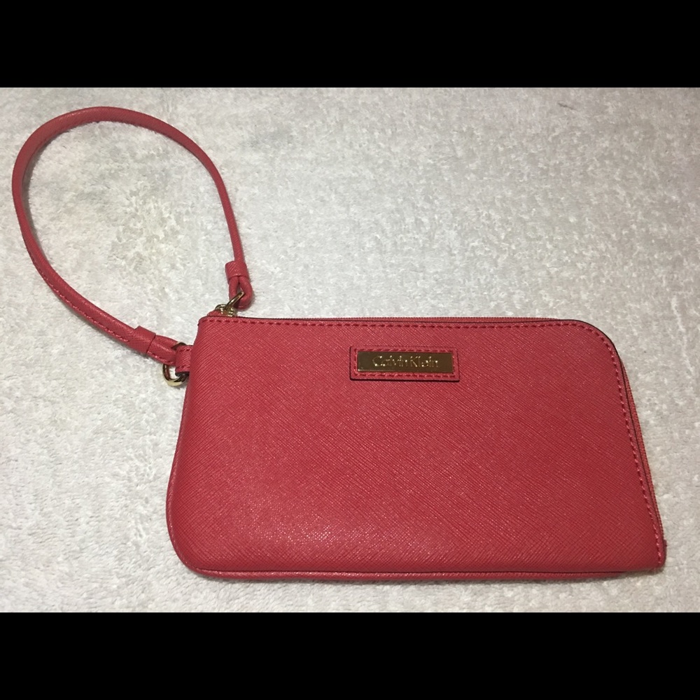 Red Calvin Klein wristlet.